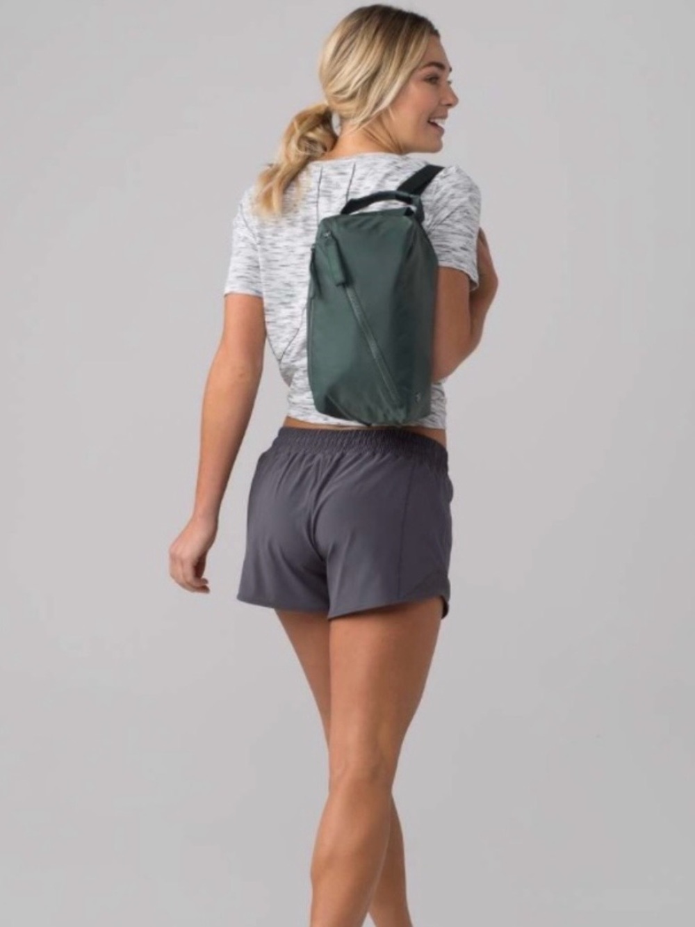 lululemon Fast Track small sling backpack in deep green